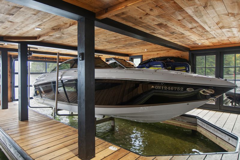 Boathouse interior showing dual lift installation