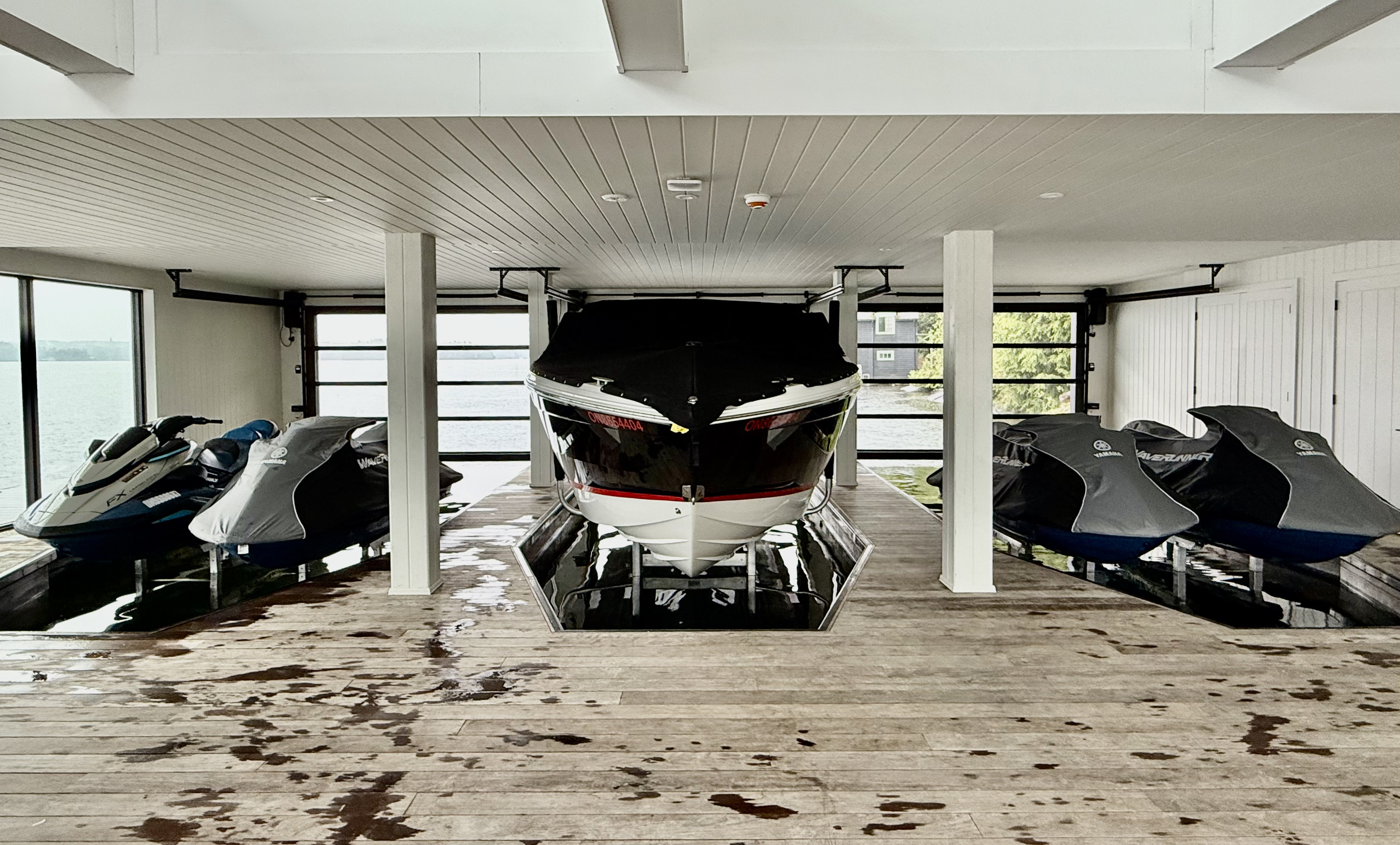 Premium boathouse with Sunstream lifts for boat and PWCs