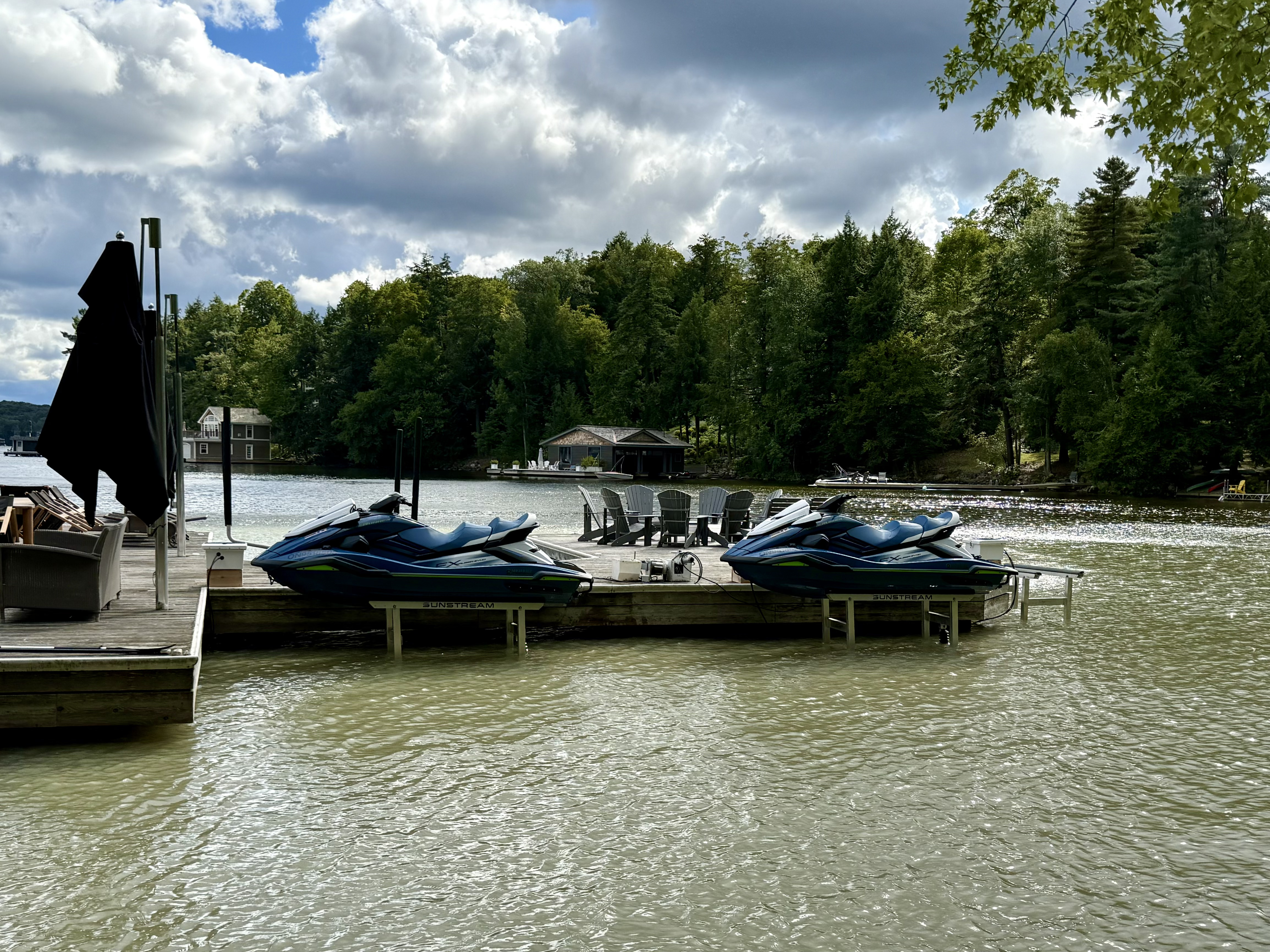 Two Yamaha PWCs on Sunstream dock lifts at Ontario cottage